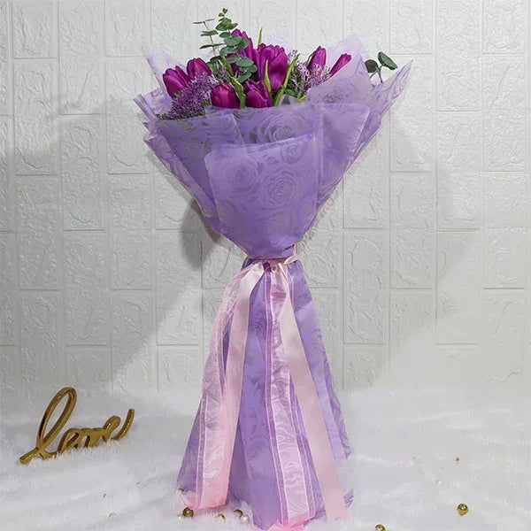 purple tulips bouquet with brassica front view