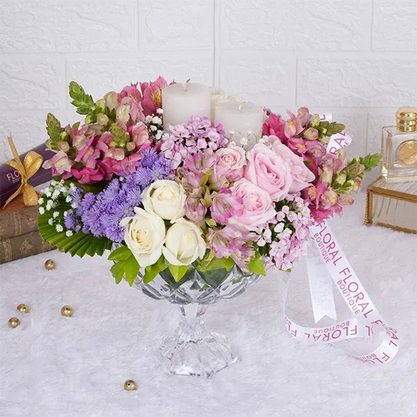 sweet avalanche roses snap dragons white roses in crystal glass vase front view
