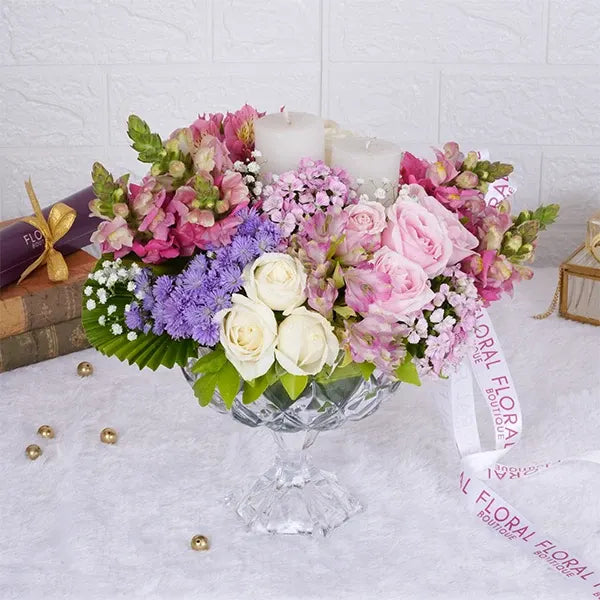sweet avalanche roses snap dragons white roses in crystal glass vase close up view