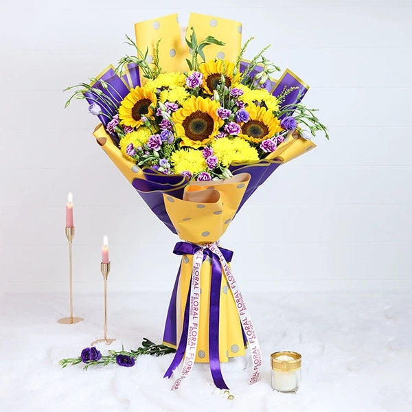 sunflower bouquet with yellow and purple wrap front view
