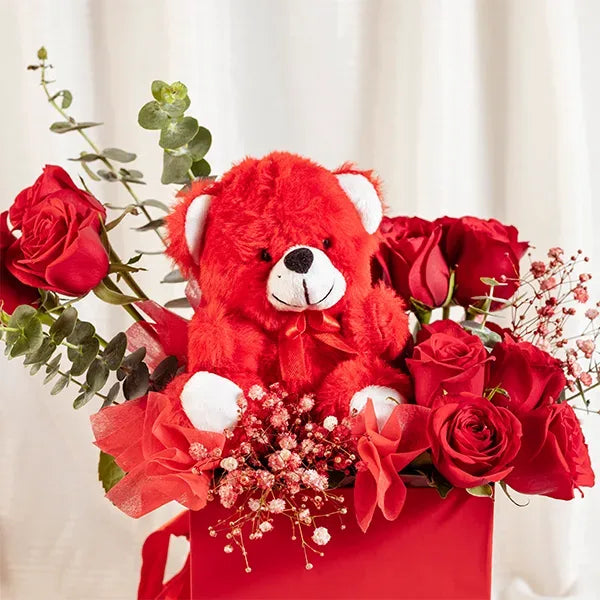 flower box arrangement of red roses with gypsophilia close up view