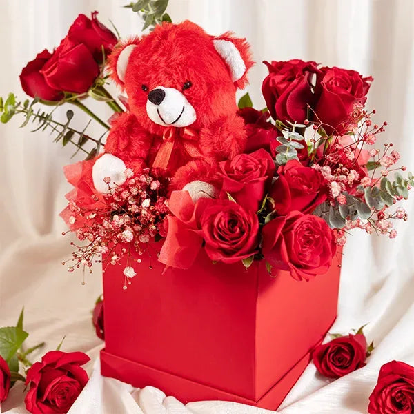 flower box arrangement of red roses with gypsophilia front view