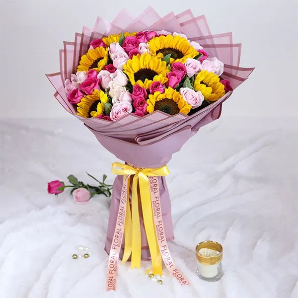 sunflower and pink rose bouquet with purple wrap front view 3