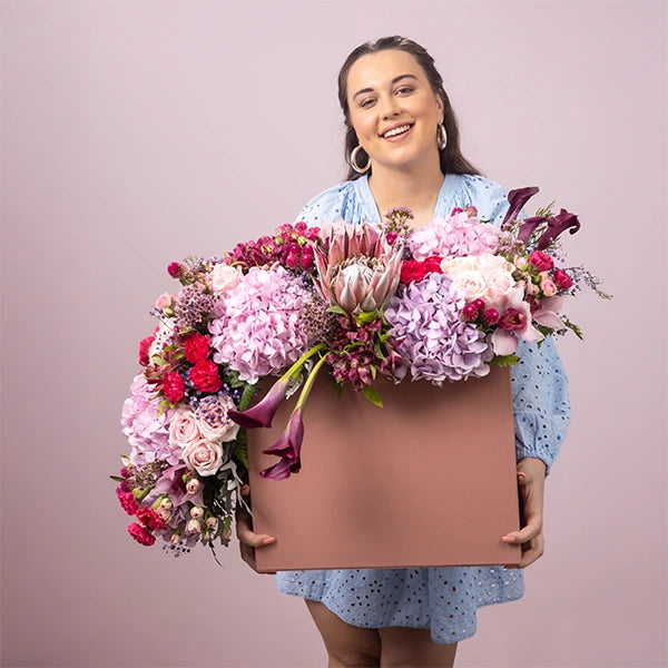 luxury box arrangement of carnation dark pink sweet avalanche roses front view 3