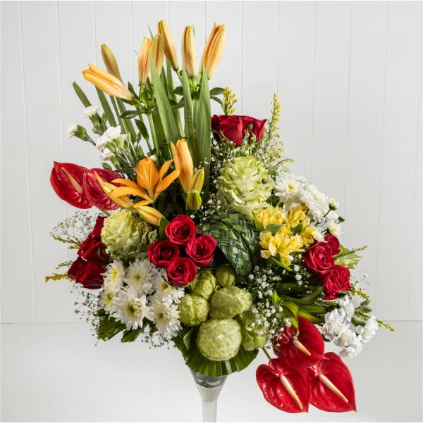 tropical bloom extravaganza in a whimsical wine glass vase closeup view 2