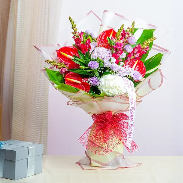mix flower bouquet of red anthuriums pink hydrangea and snapdragon front view