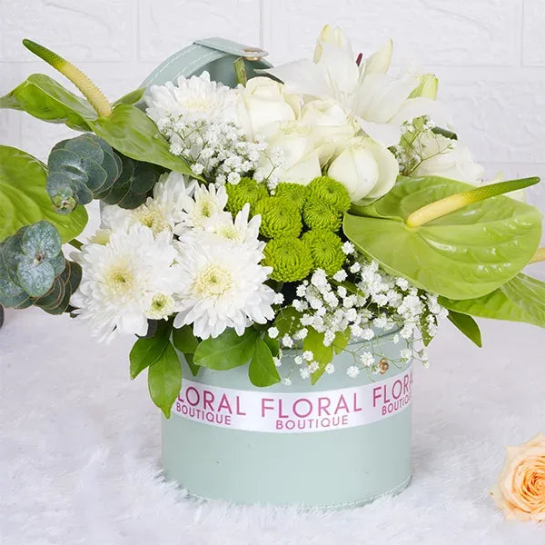 white roses green anthuriums white asiatic lily in light green box front view
