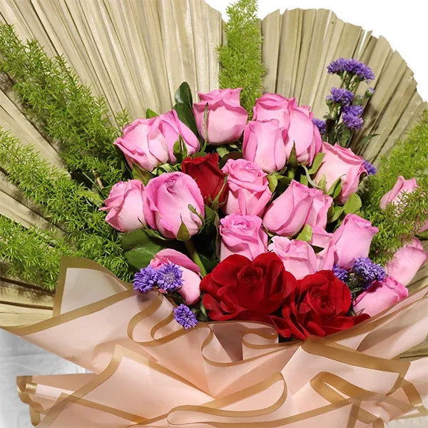vibrant revival pink roses and red roses bouquet close up view